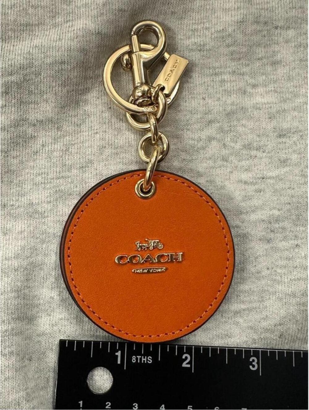 Coach orange leather keychain charm with mirror